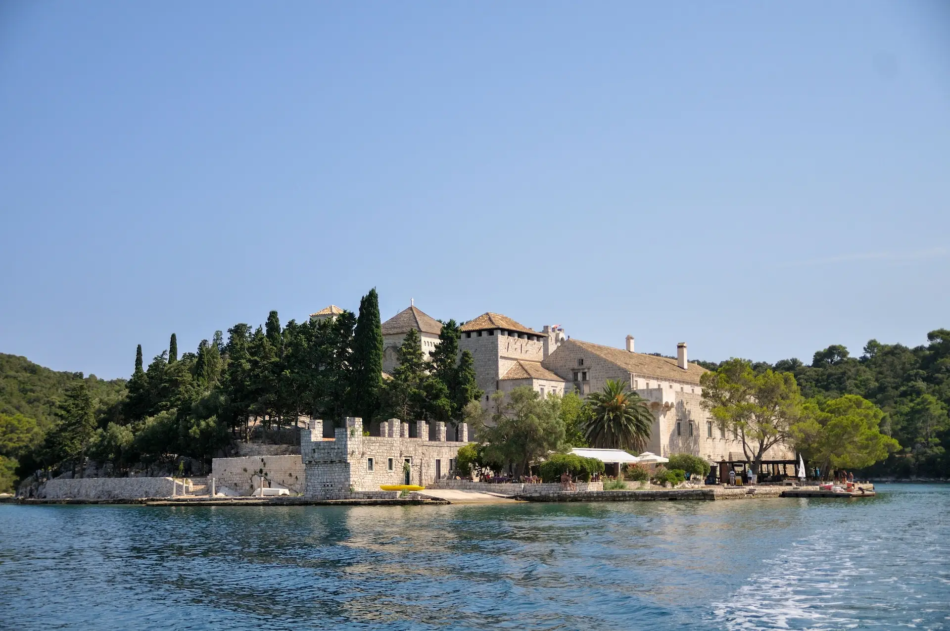 Majestic Benedictine monastery at Mljet park, stands atop a verdant hillside