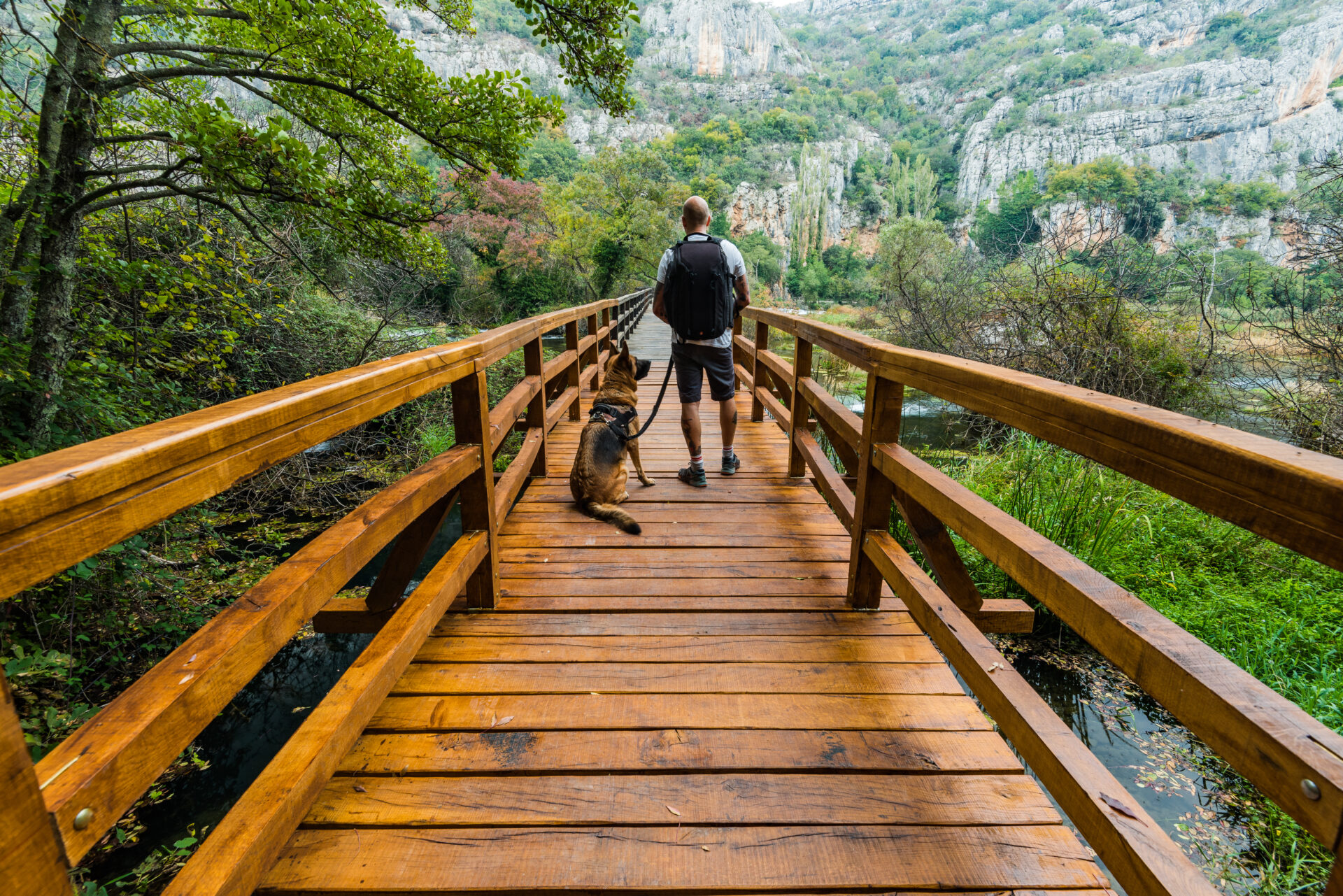 Active man with dog in Krka National Park,Croatia