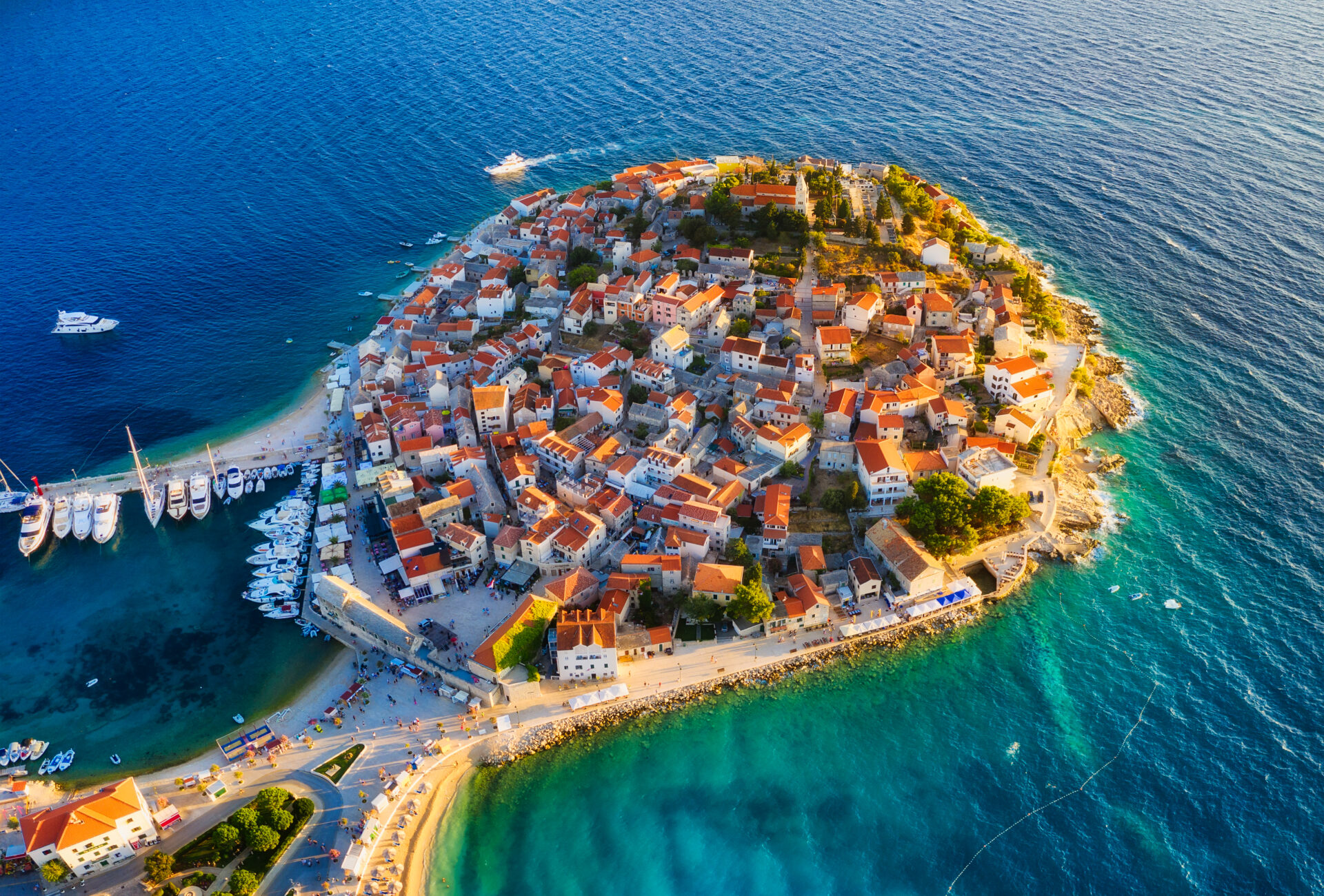 Primosten town, Croatia. View of the city from the air. Seascape with beach and old town.